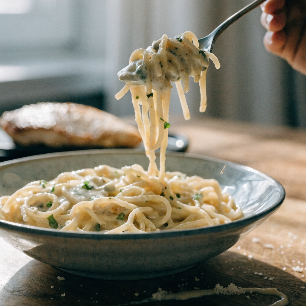 Close-up of crock pot angel chicken with creamy italian sauce